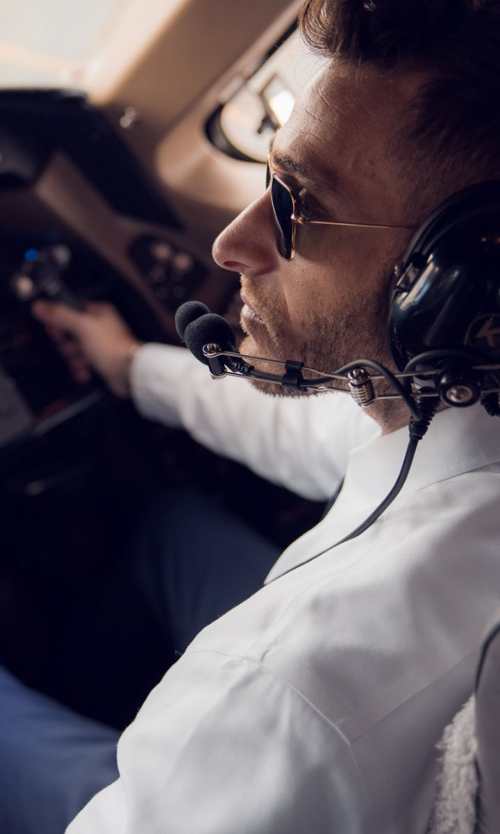 a pilot in the cockpit of a plane