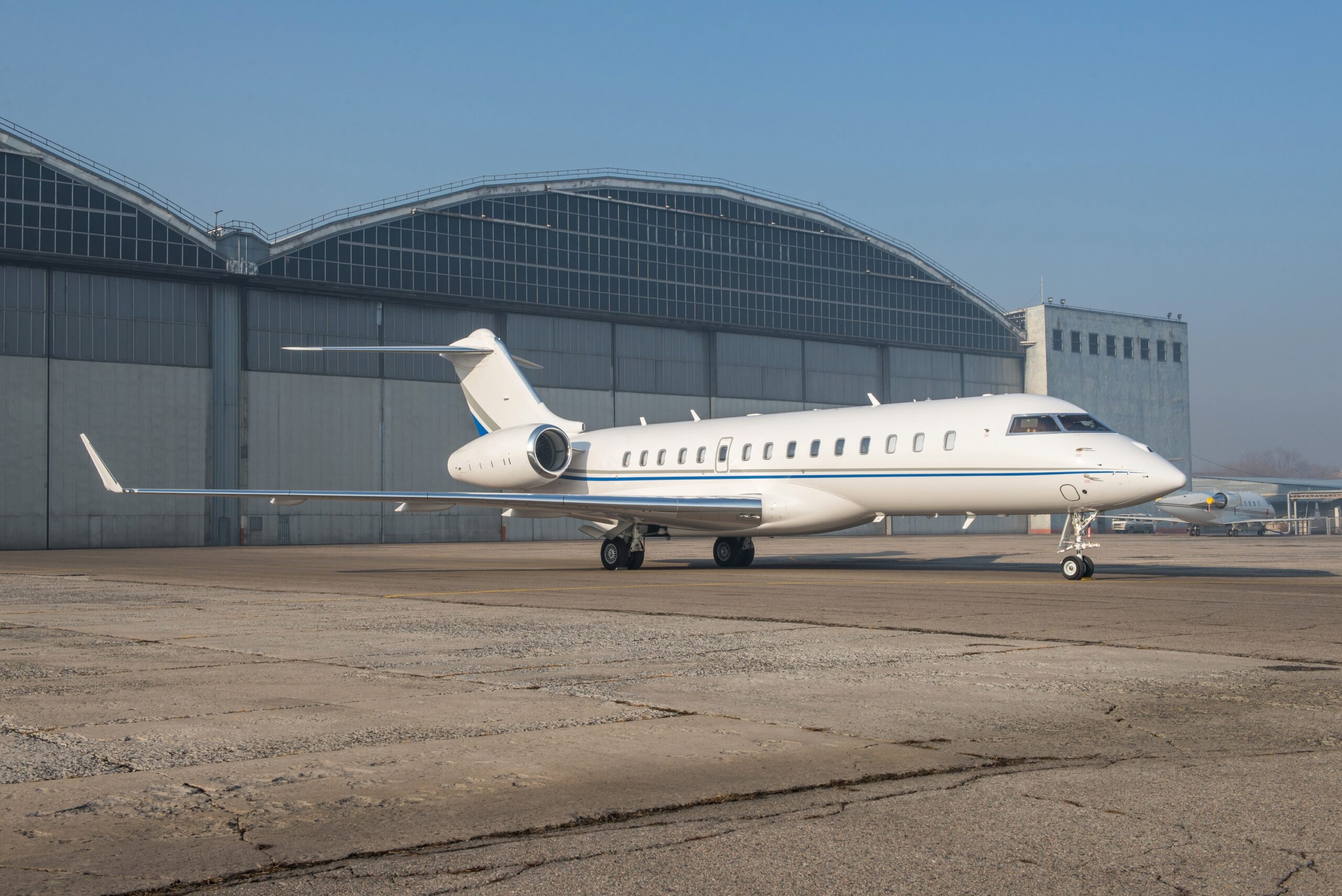 Bombardier Global 6000 exterior in white on the ground at airport outside hangar