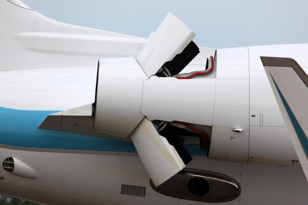 Close up view of private jet engine thrust reverser engaged