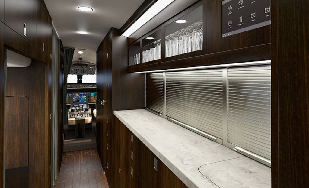 Bombardier Global 6000 Interior galley with hardwood floors and cockpit behind