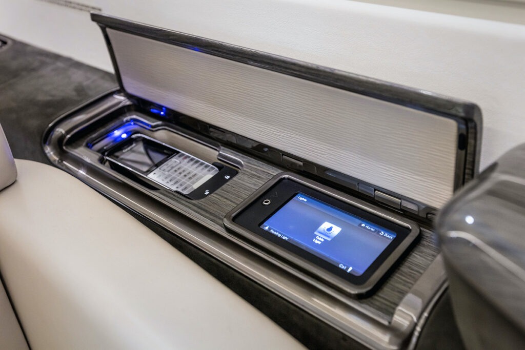 Embraer Legacy 500 sat phone and cabin management system touchscreen controls in side panel