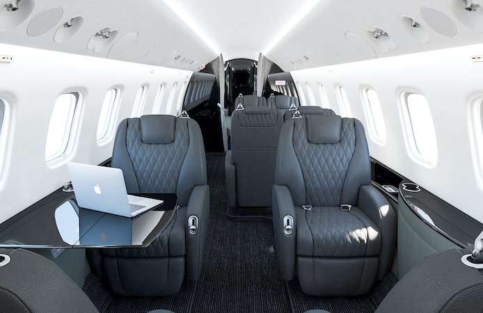Embraer Legacy 650E Interior dark leather looking back through cabin